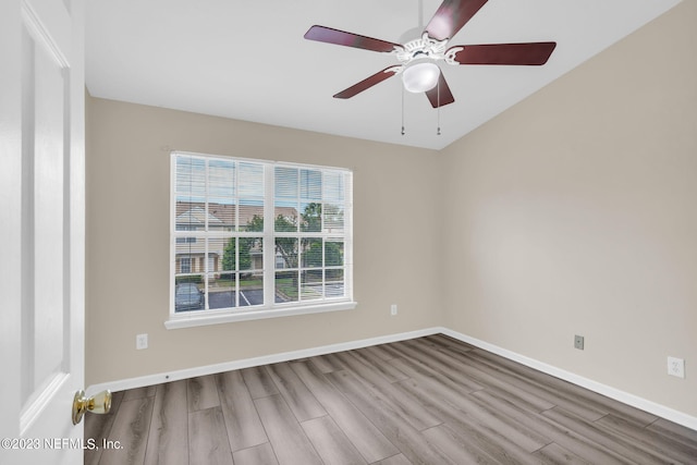 empty room with light hardwood / wood-style flooring and ceiling fan