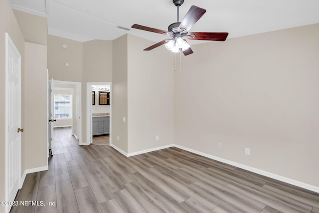 spare room with light wood-type flooring and ceiling fan