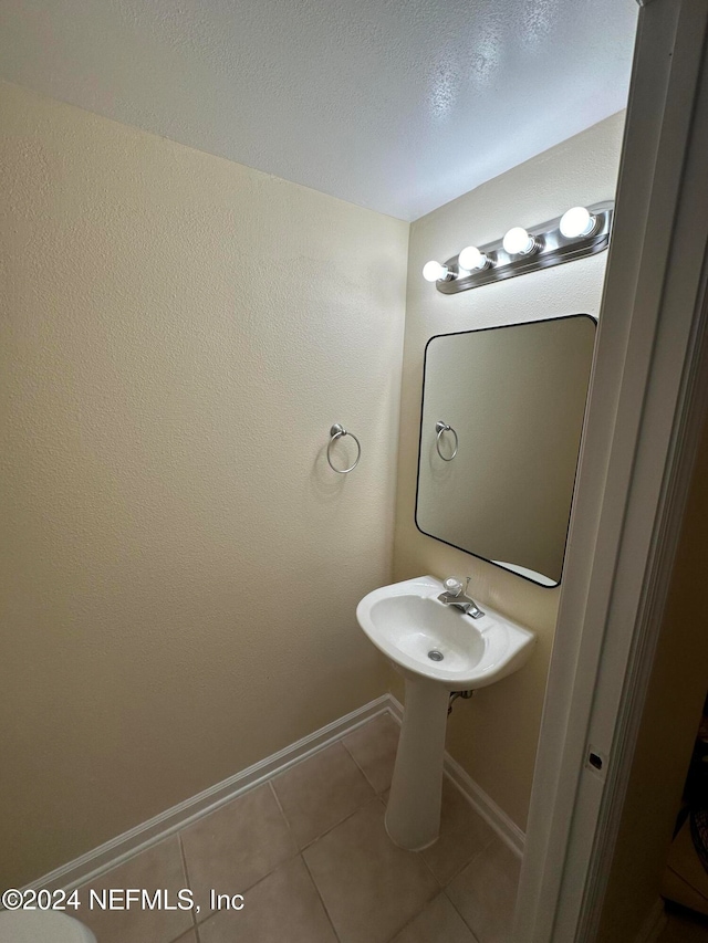 bathroom featuring tile patterned floors and sink