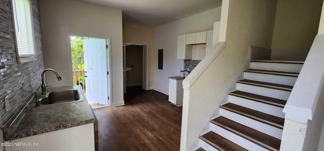 interior space with sink and hardwood / wood-style floors