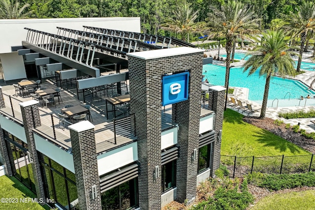 view of property featuring a community pool