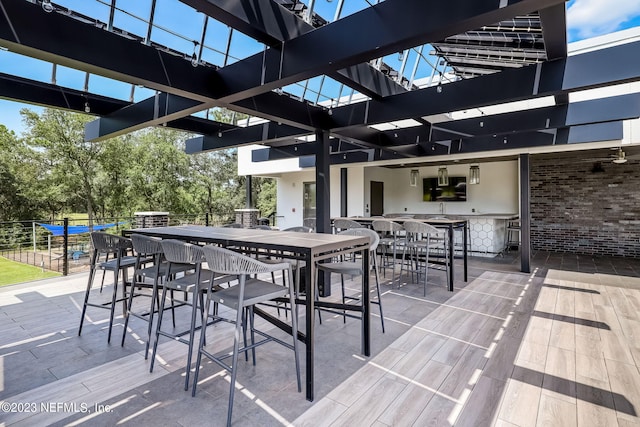 view of patio / terrace featuring an outdoor bar