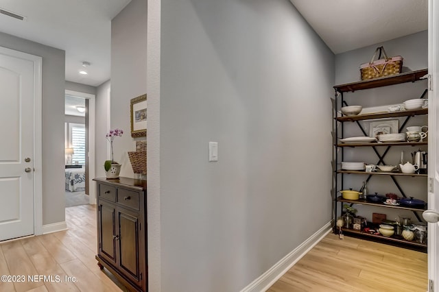 corridor featuring light hardwood / wood-style flooring