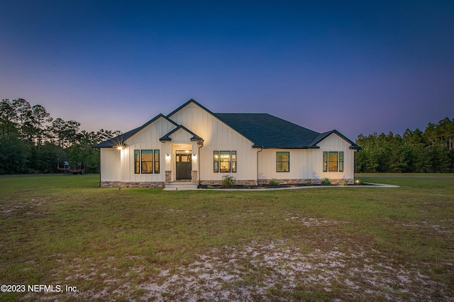 modern farmhouse featuring a yard