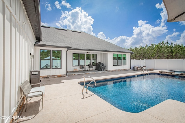 view of swimming pool with a patio area