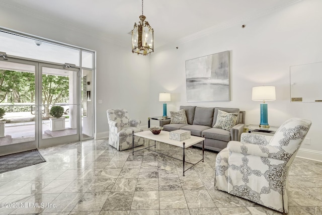 living room with crown molding and an inviting chandelier