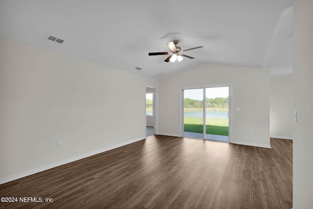 unfurnished room with dark wood-type flooring, ceiling fan, and vaulted ceiling