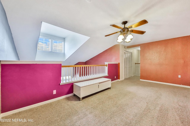 additional living space with lofted ceiling, ceiling fan, and carpet