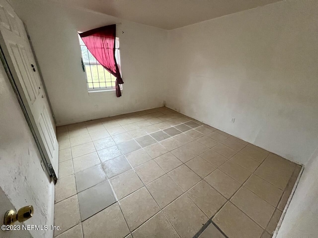 unfurnished bedroom with light tile patterned floors