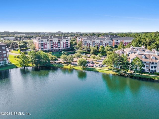 birds eye view of property with a water view and a residential view