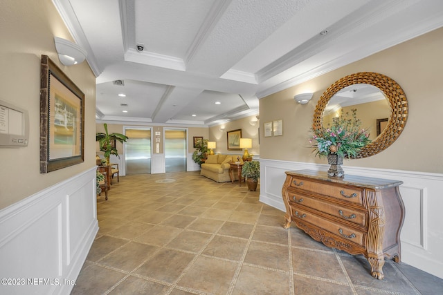 hall with a wainscoted wall, crown molding, and a decorative wall