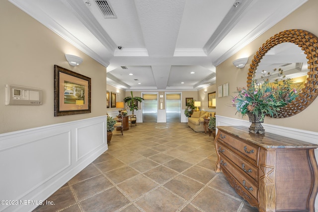 hallway with beam ceiling, ornamental molding, coffered ceiling, and french doors