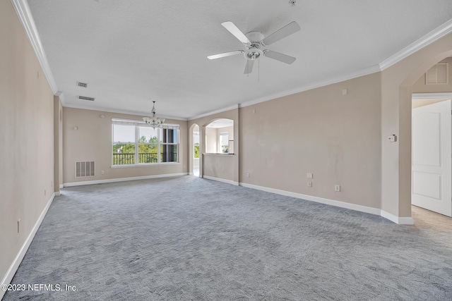 carpeted spare room with ornamental molding and ceiling fan with notable chandelier