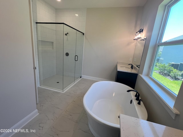 bathroom with marble finish floor, baseboards, vanity, and a shower stall