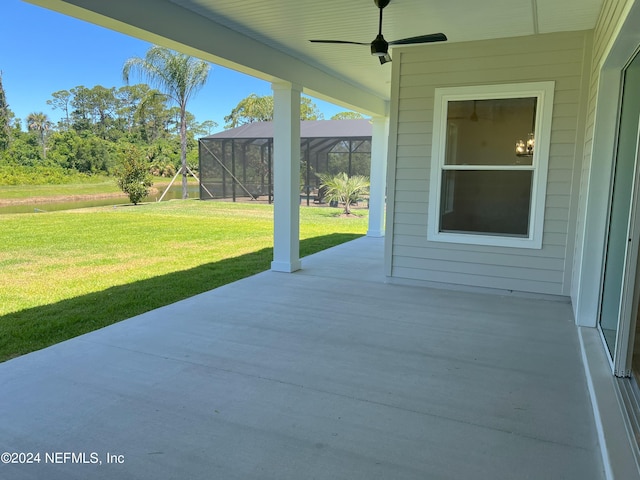 view of patio / terrace with glass enclosure and ceiling fan