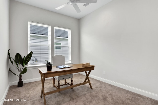 office space with ceiling fan and light colored carpet