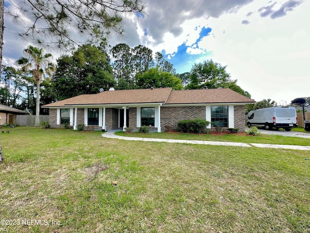 ranch-style home with a front yard