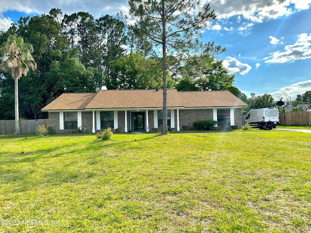 ranch-style house with a front lawn