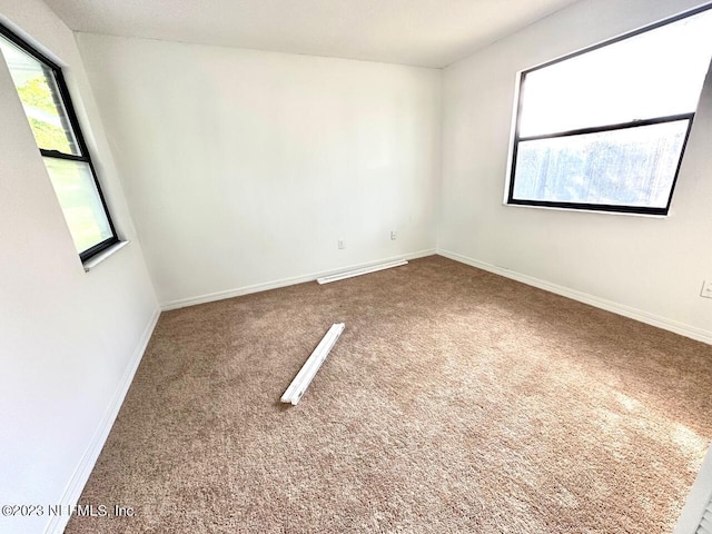 empty room featuring carpet flooring