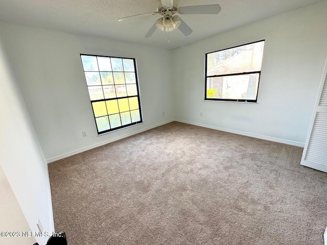 unfurnished room featuring ceiling fan, a textured ceiling, and carpet flooring