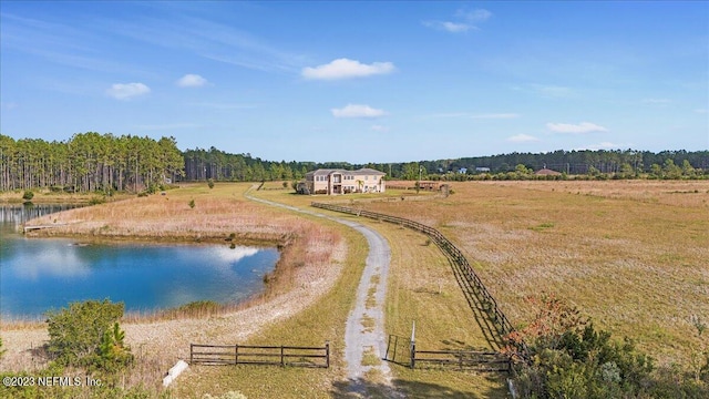 drone / aerial view with a water view and a rural view