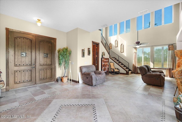 entrance foyer with ceiling fan