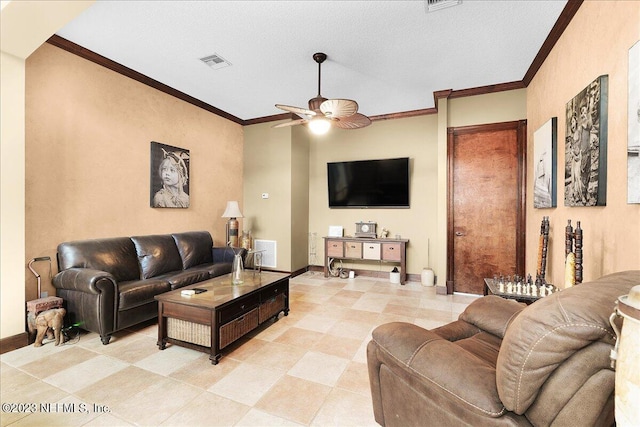 tiled living room with ornamental molding, ceiling fan, and a textured ceiling