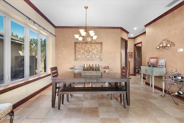 dining space featuring ornamental molding and a notable chandelier