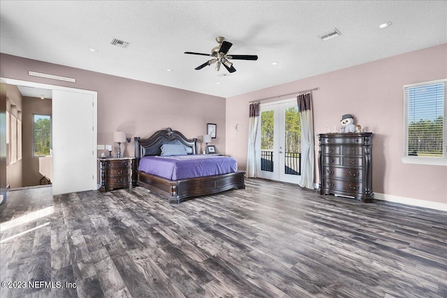 bedroom with ceiling fan, french doors, dark wood-type flooring, access to exterior, and a textured ceiling