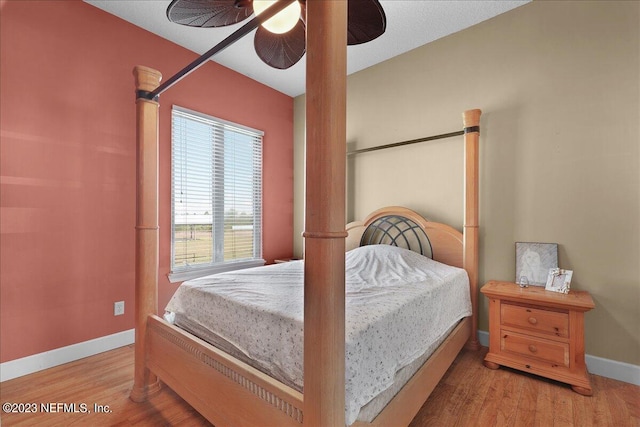 bedroom featuring ceiling fan and wood-type flooring