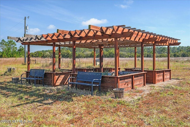 view of community with a rural view and a pergola