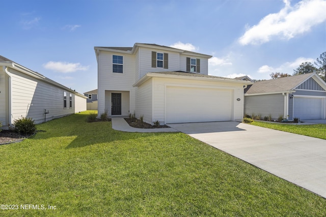 traditional-style house with a garage, a front yard, and concrete driveway