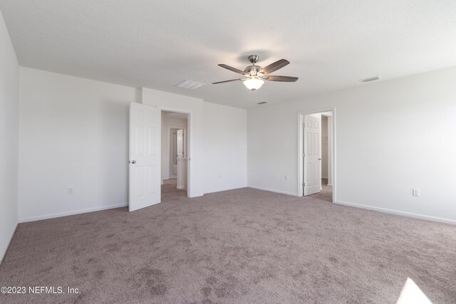 empty room with carpet and ceiling fan