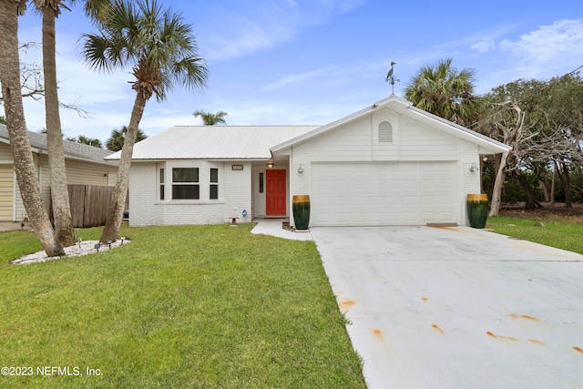 ranch-style house featuring a garage and a front lawn