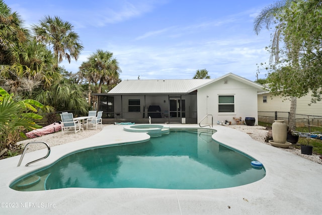 view of pool with a patio area and a sunroom