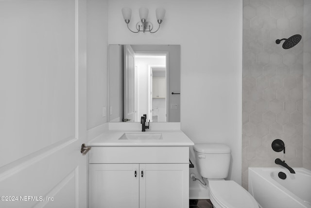 full bathroom featuring vanity, toilet, and tiled shower / bath combo