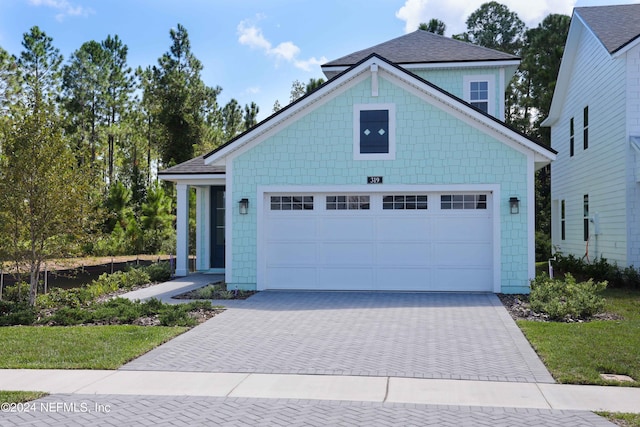 view of front of property with a garage