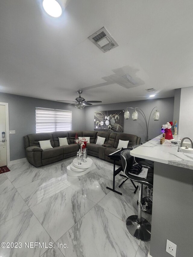 living room featuring ceiling fan