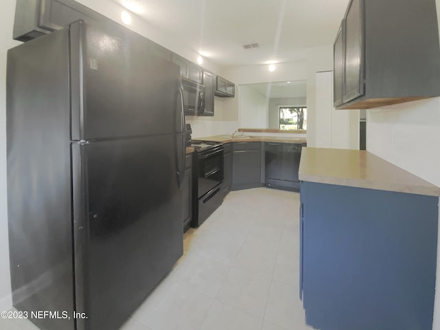 kitchen featuring sink and black appliances