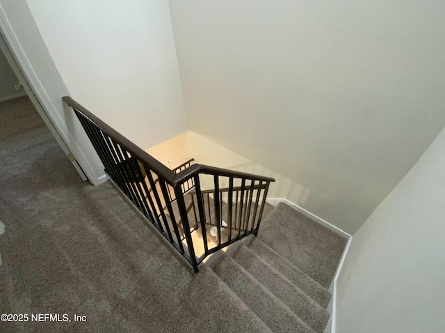 stairs with carpet flooring and baseboards