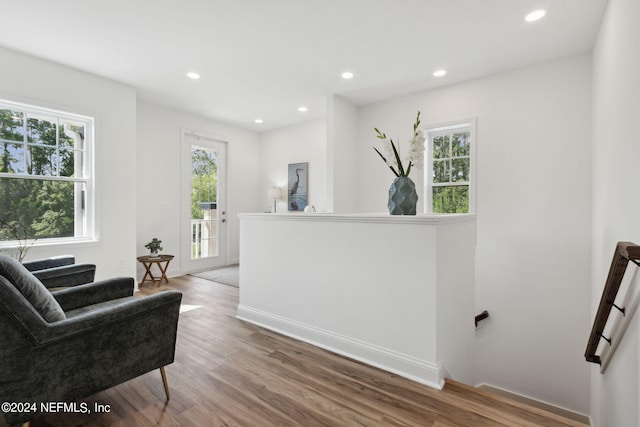 living area with hardwood / wood-style floors