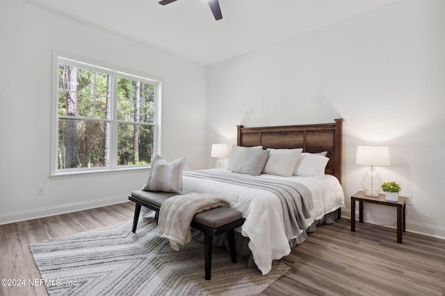 bedroom featuring hardwood / wood-style flooring and ceiling fan