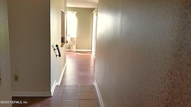 7602 Las Palmas Way Unit 181, Jacksonville, FL 32256 - hall with baseboards and tile patterned flooring