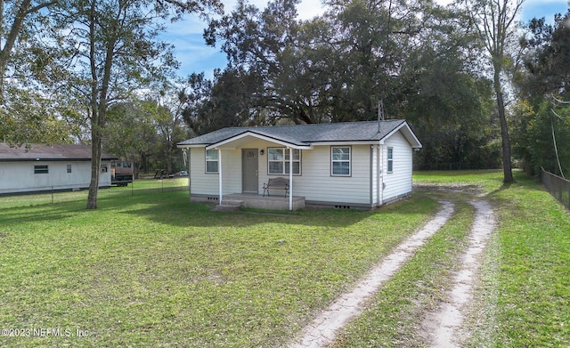 bungalow-style house with covered porch and a front yard