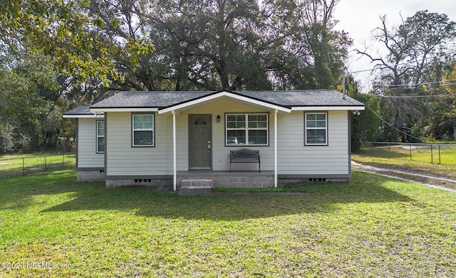 bungalow-style home with a front yard