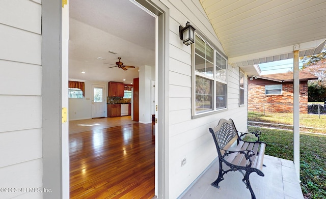 exterior space featuring ceiling fan and lofted ceiling