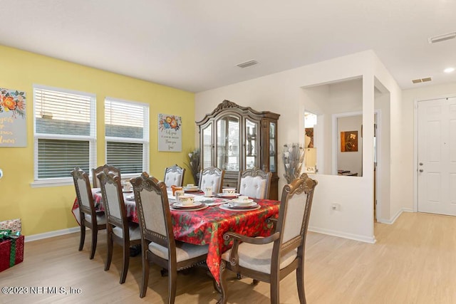 dining room featuring light hardwood / wood-style flooring