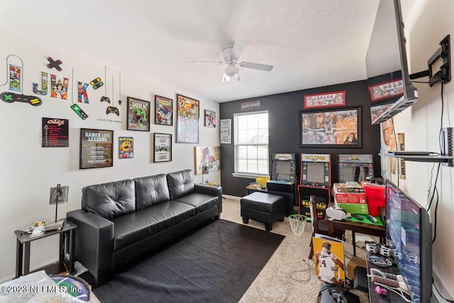 carpeted living room with ceiling fan and a textured ceiling