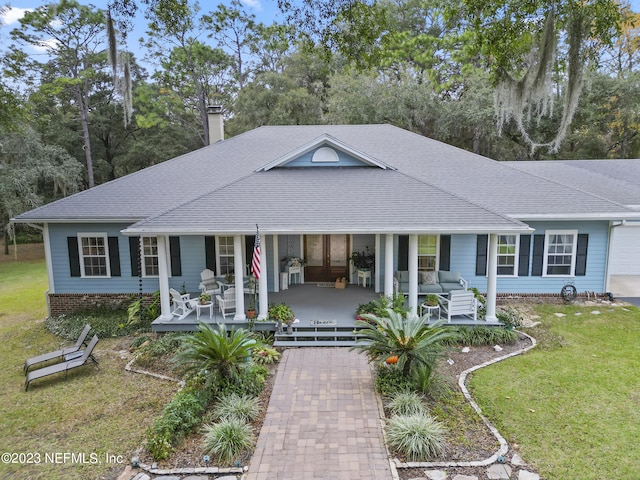 single story home featuring a front yard and a porch