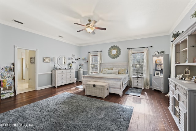 bedroom with dark wood-type flooring, ceiling fan, connected bathroom, and crown molding